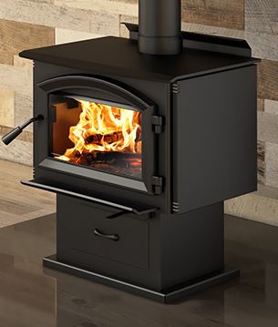 Black wood stove with flames inside, set against a wooden wall.